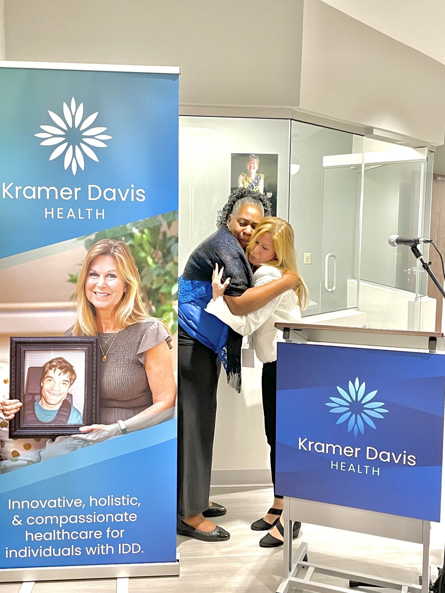 In this photo, the mothers of the two patients our clinic is named for embrace in a heartfelt hug.
